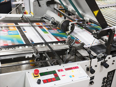 image of bindery folding machine in action